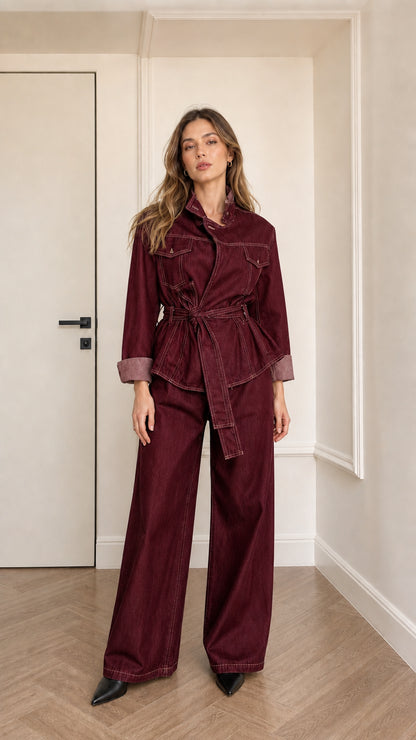 Model wearing burgundy denim utility jacket and matching pants