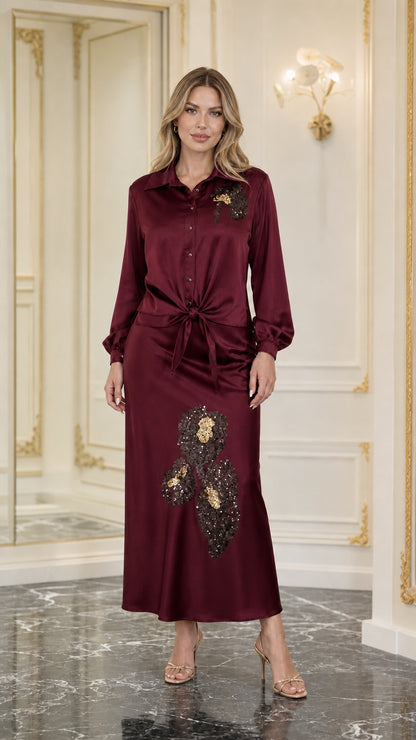 Model wearing burgundy satin sequined two-piece set
