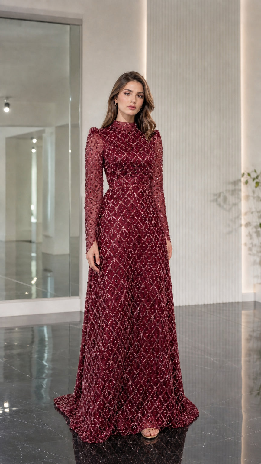 Model wearing burgundy wine red long sleeve beaded evening gown