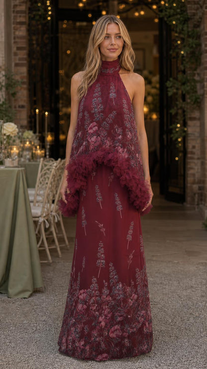 Model wearing burgundy floral print ruffled halter maxi dress