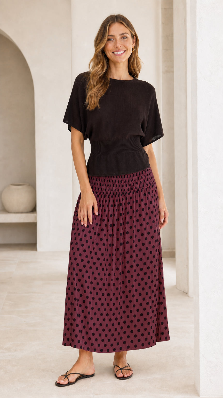Front view of contrast knit bodice maxi dress with burgundy polka dot skirt