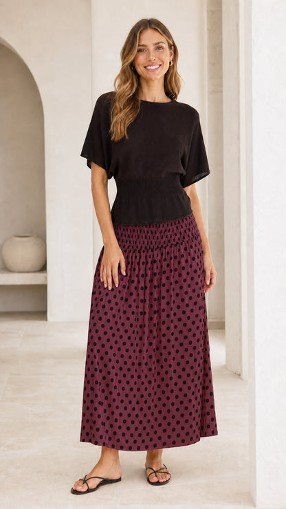 Front view of contrast knit bodice maxi dress with burgundy polka dot skirt