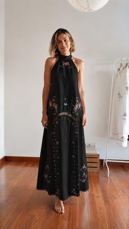 Front view of black embroidered halter maxi dress