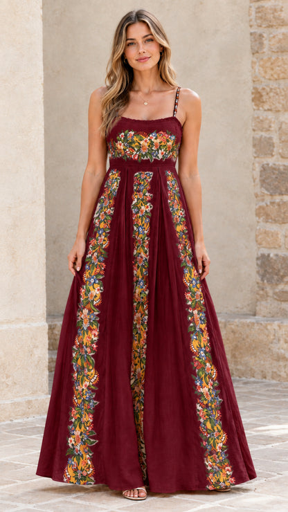 Full-length view of burgundy floral pleated maxi dress