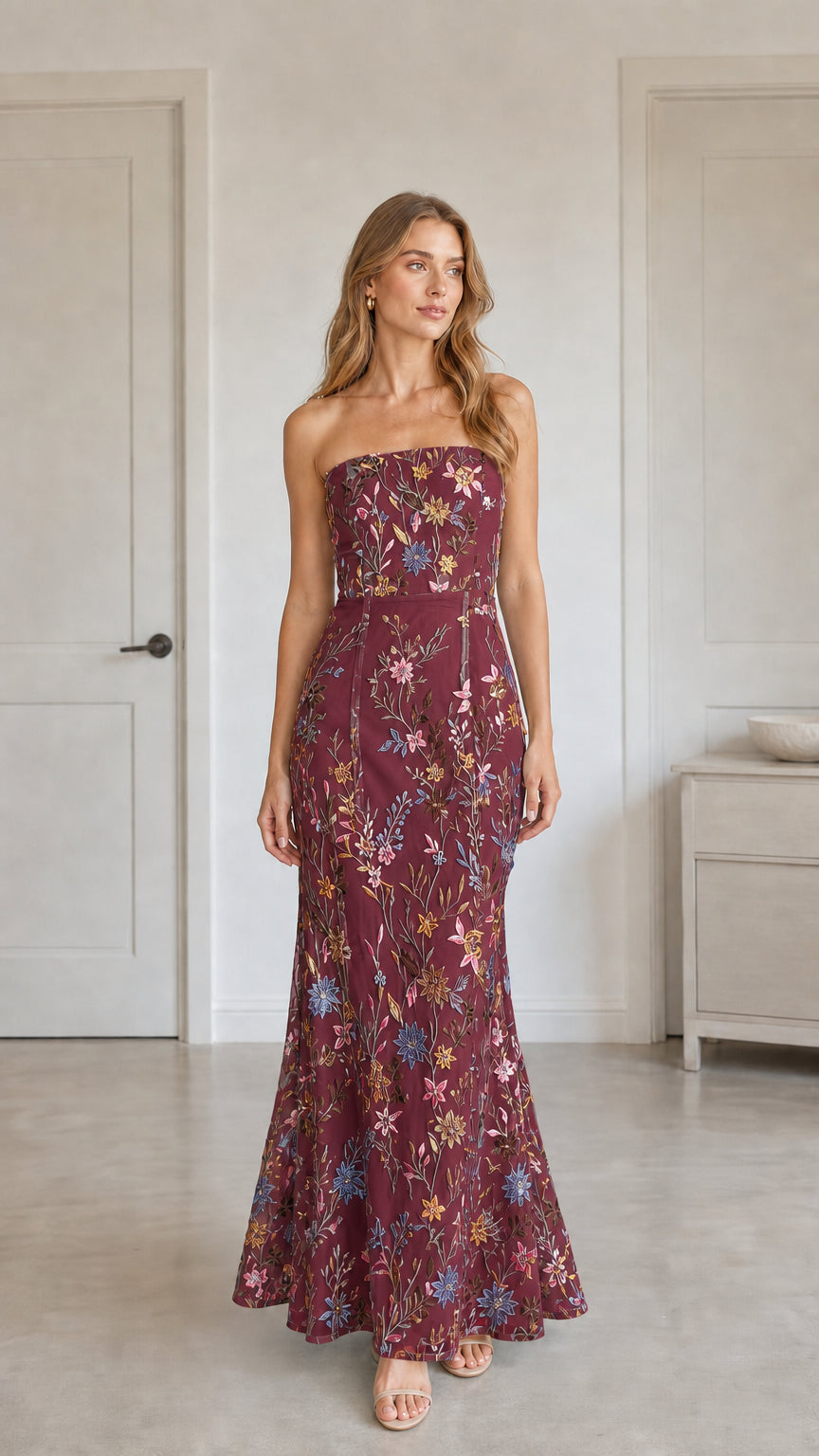 Front view of burgundy floral embroidered strapless maxi dress