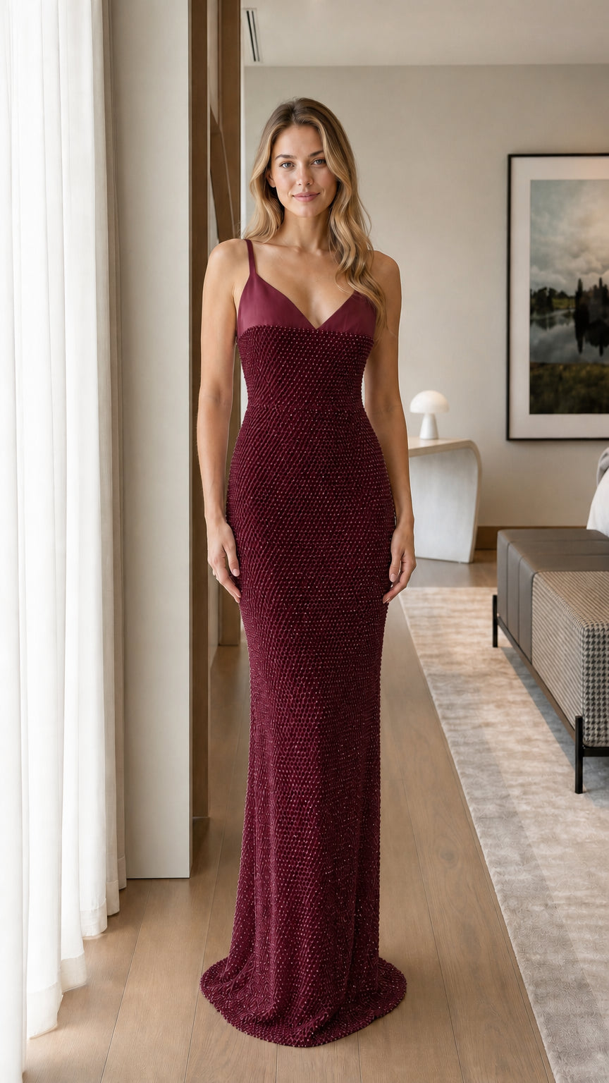 Model wearing burgundy sequin maxi dress