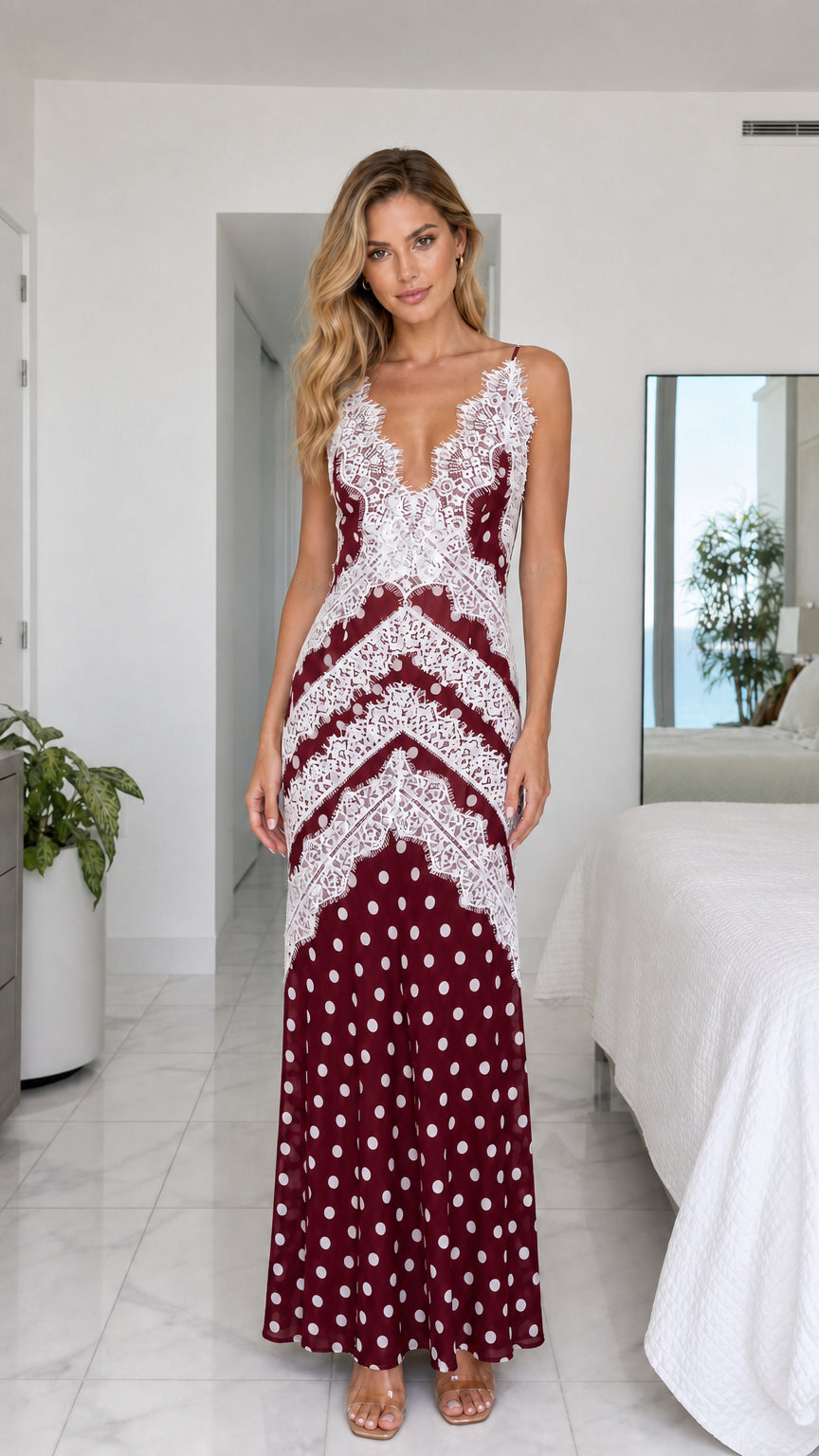 Model wearing burgundy wine polka dot maxi dress with white lace trim