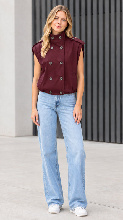 Front view of model wearing burgundy wine red double-breasted utility vest