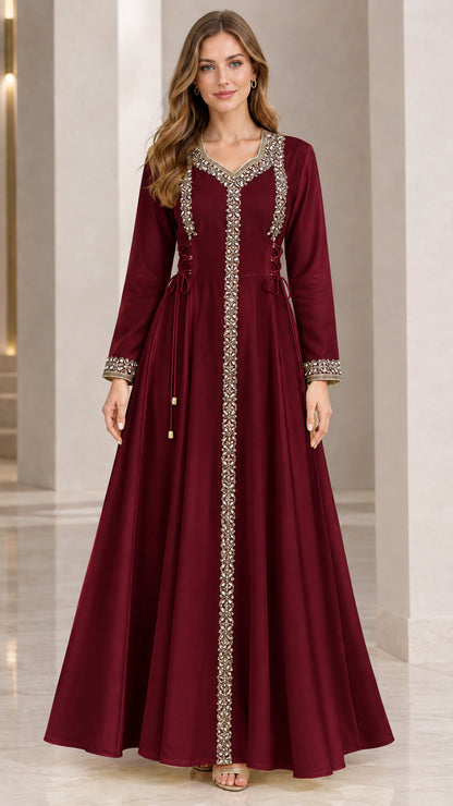 Front view of woman wearing burgundy wine red embellished long sleeve maxi gown