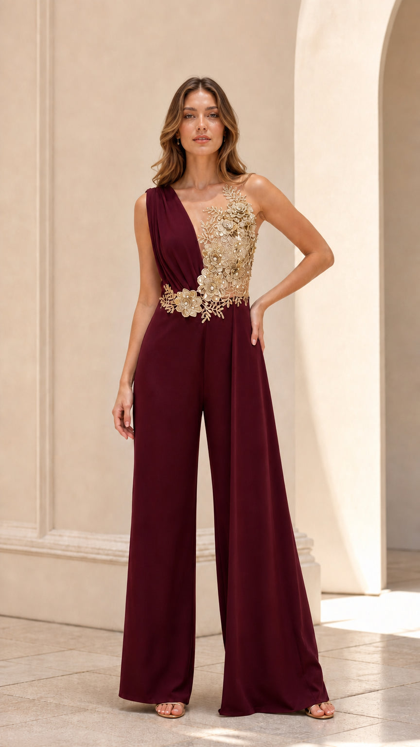 Front view of rich burgundy sleeveless evening jumpsuit with gold floral appliqué detail