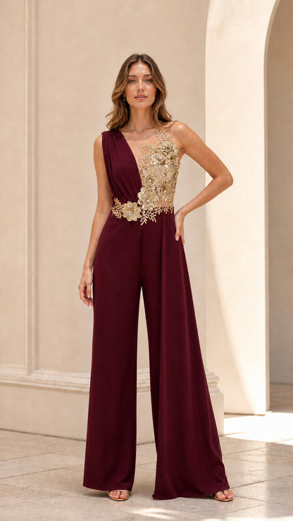 Front view of rich burgundy sleeveless evening jumpsuit with gold floral appliqué detail