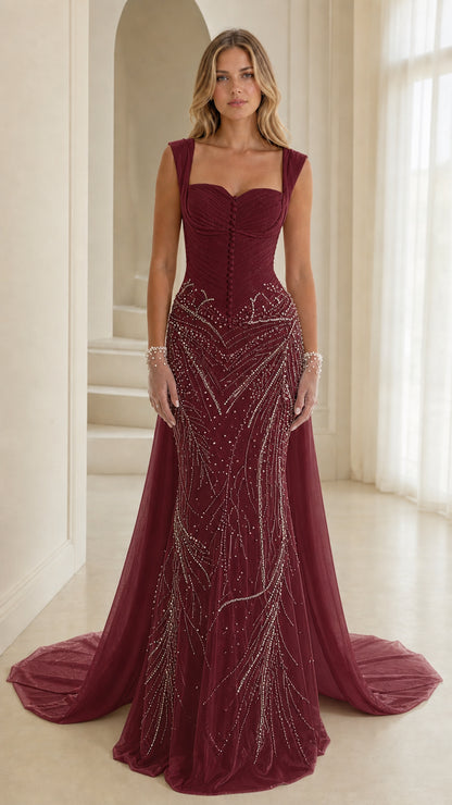 Front view of deep burgundy embellished mermaid gown