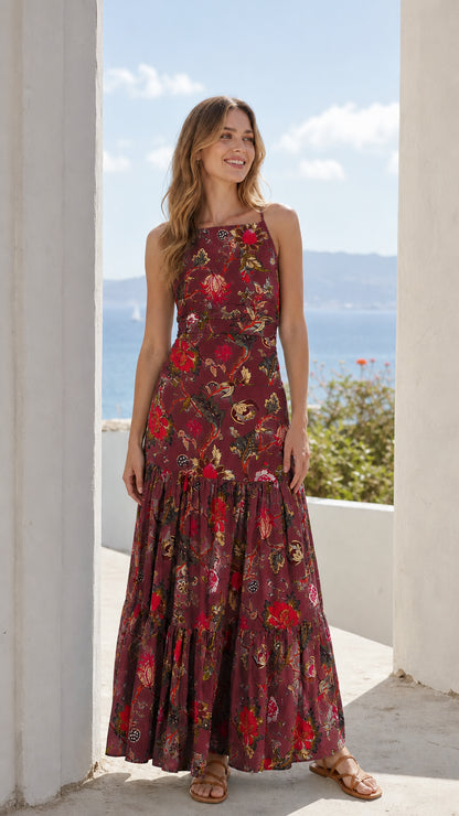 Woman wearing burgundy floral tiered maxi dress