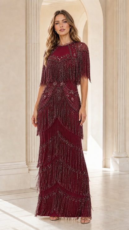 Front view of woman wearing burgundy wine red sequin fringe formal maxi dress