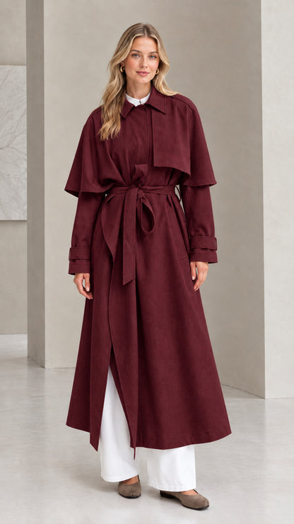 Front view of burgundy wine capelet maxi trench coat