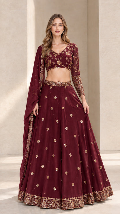 Front full view of maroon embroidered lehenga choli set with rich gold detailing