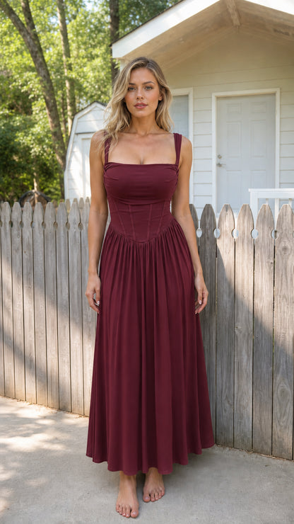 Front view of woman wearing burgundy corset cami maxi dress