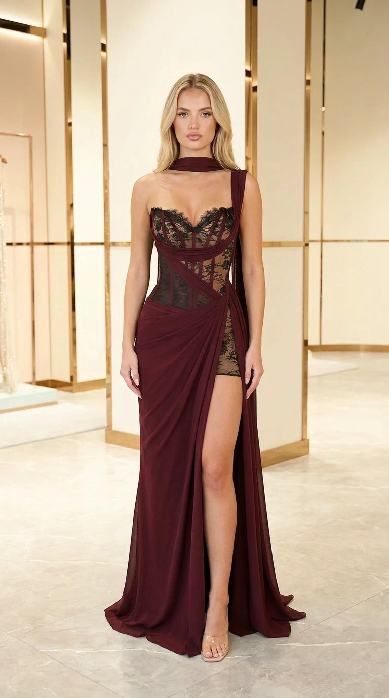 Front view of model in burgundy wine draped lace corset maxi formal dress