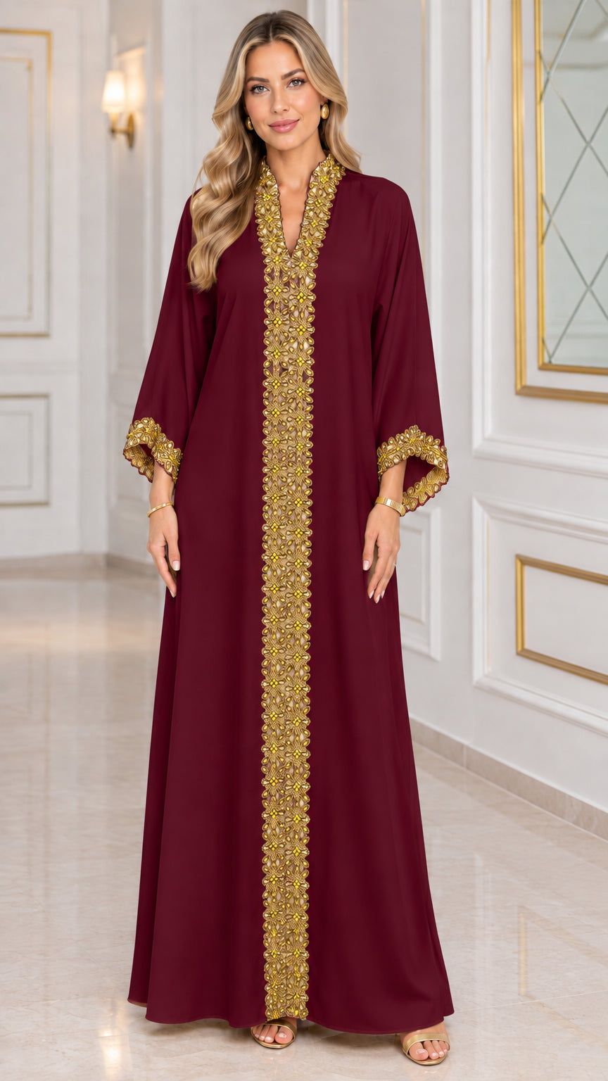 Front view of burgundy kaftan maxi dress with gold metallic trim