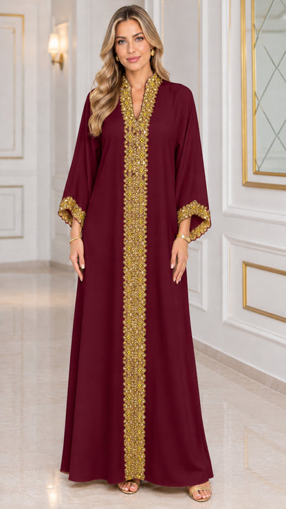 Front view of burgundy kaftan maxi dress with gold metallic trim