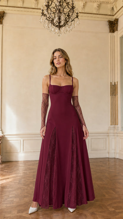 Model wearing burgundy wine red bustier formal gown with matching lace gloves