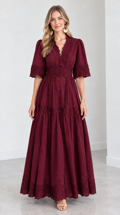Front view of woman wearing a burgundy wine red V-neck lace trim tiered maxi dress