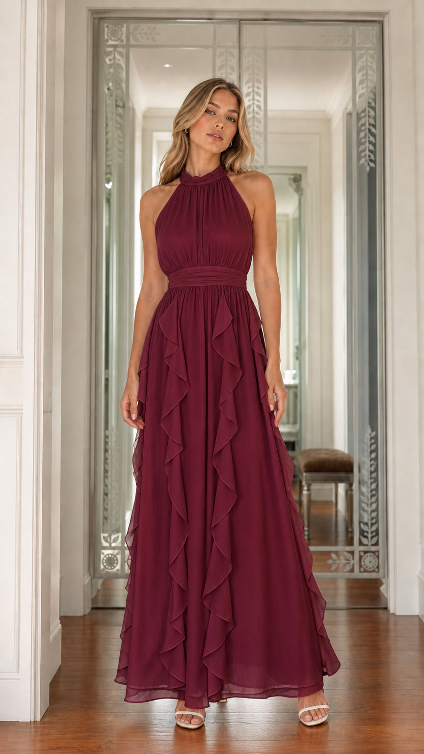 Full front view of model wearing burgundy halter neck cascading ruffle maxi dress