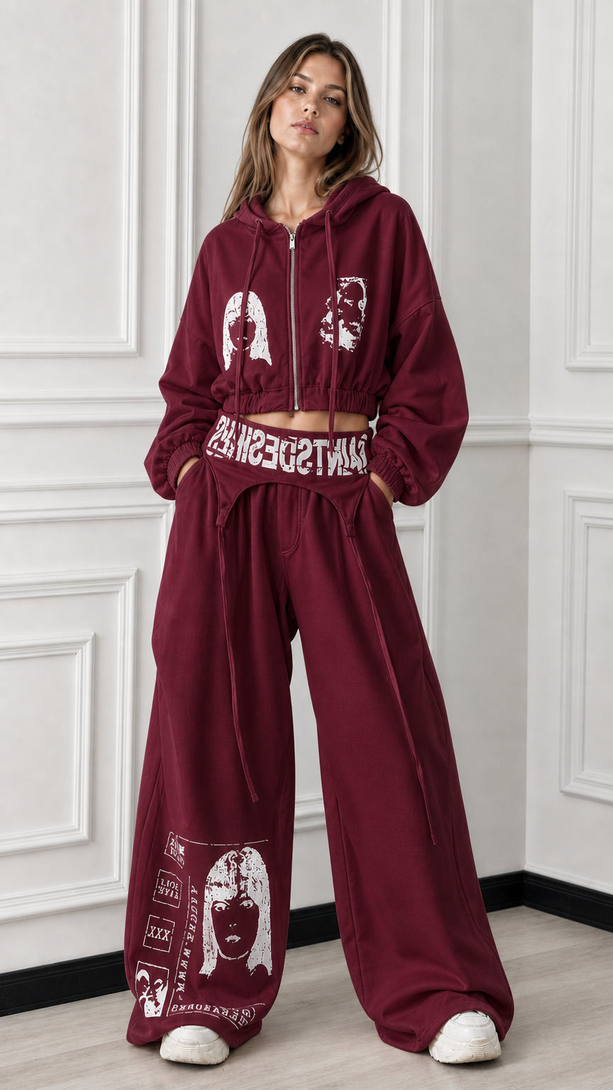 Full front view of burgundy maroon 2-piece cropped zip hoodie and wide-leg graphic sweatpants set