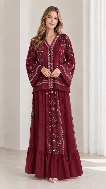 Model wearing burgundy red floral embroidered two-piece maxi skirt set