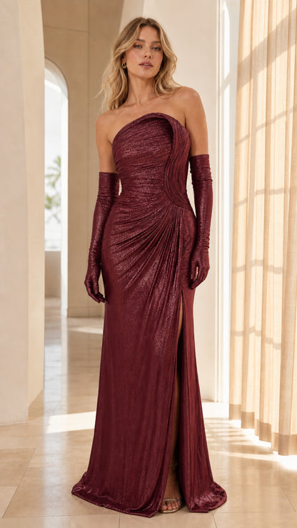 Model wearing burgundy wine metallic strapless pleated gown with gloves