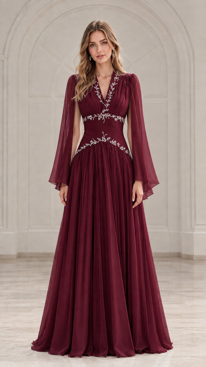 Front view of model wearing a rich burgundy wine chiffon formal gown with cape sleeves