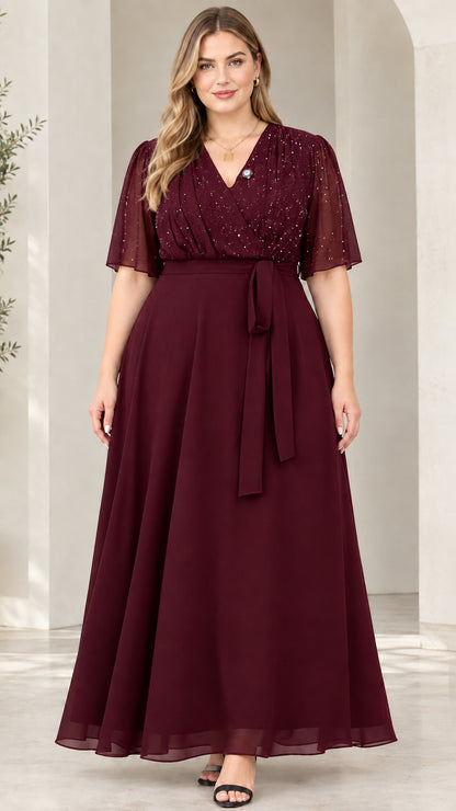 Front view of model wearing burgundy red flutter sleeve glitter evening maxi dress