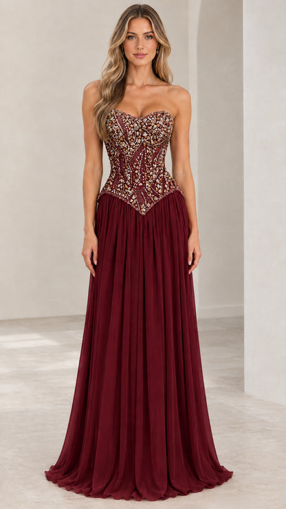 Front view of burgundy red strapless beaded corset basque waist evening gown