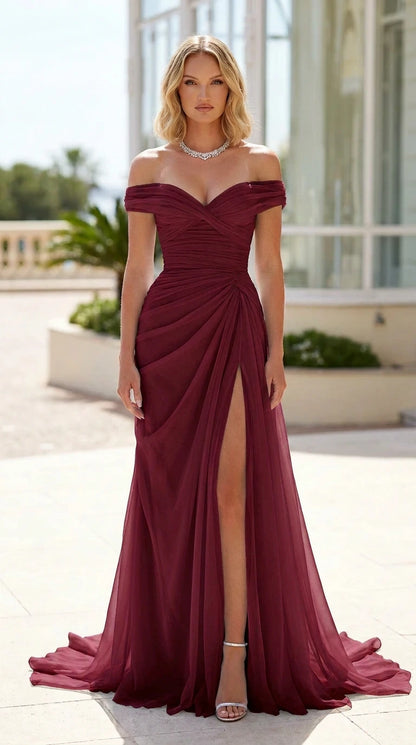 Front view of woman wearing burgundy wine sweetheart neck formal gown with slit