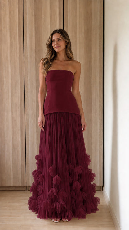 Woman wearing burgundy strapless 3d floral tulle maxi dress