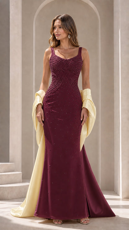 Burgundy pearl-embellished mermaid gown styled with coordinating contrast wrap