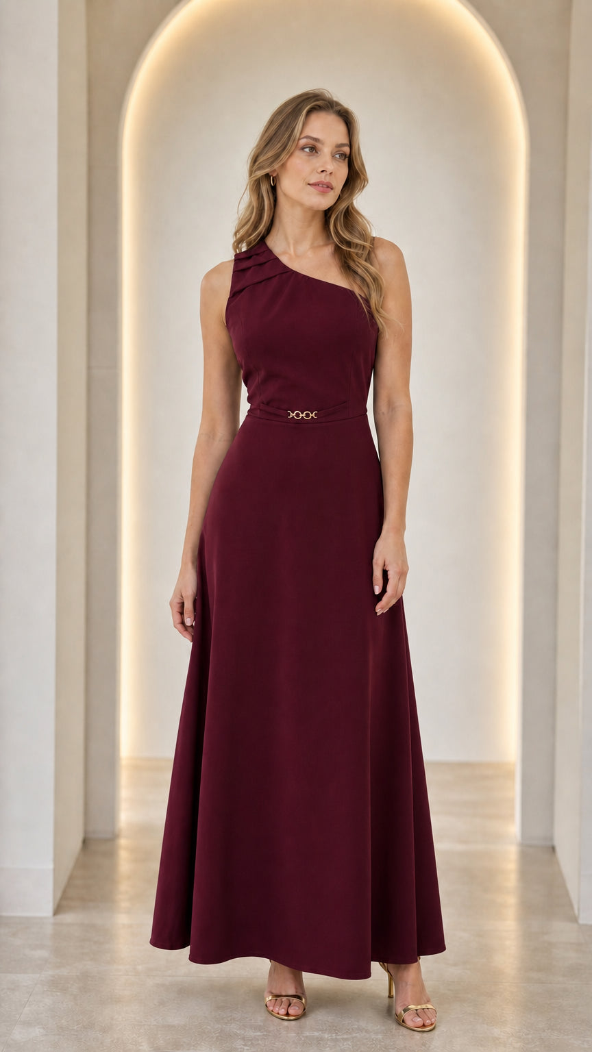 Woman wearing a burgundy one-shoulder pleated maxi dress