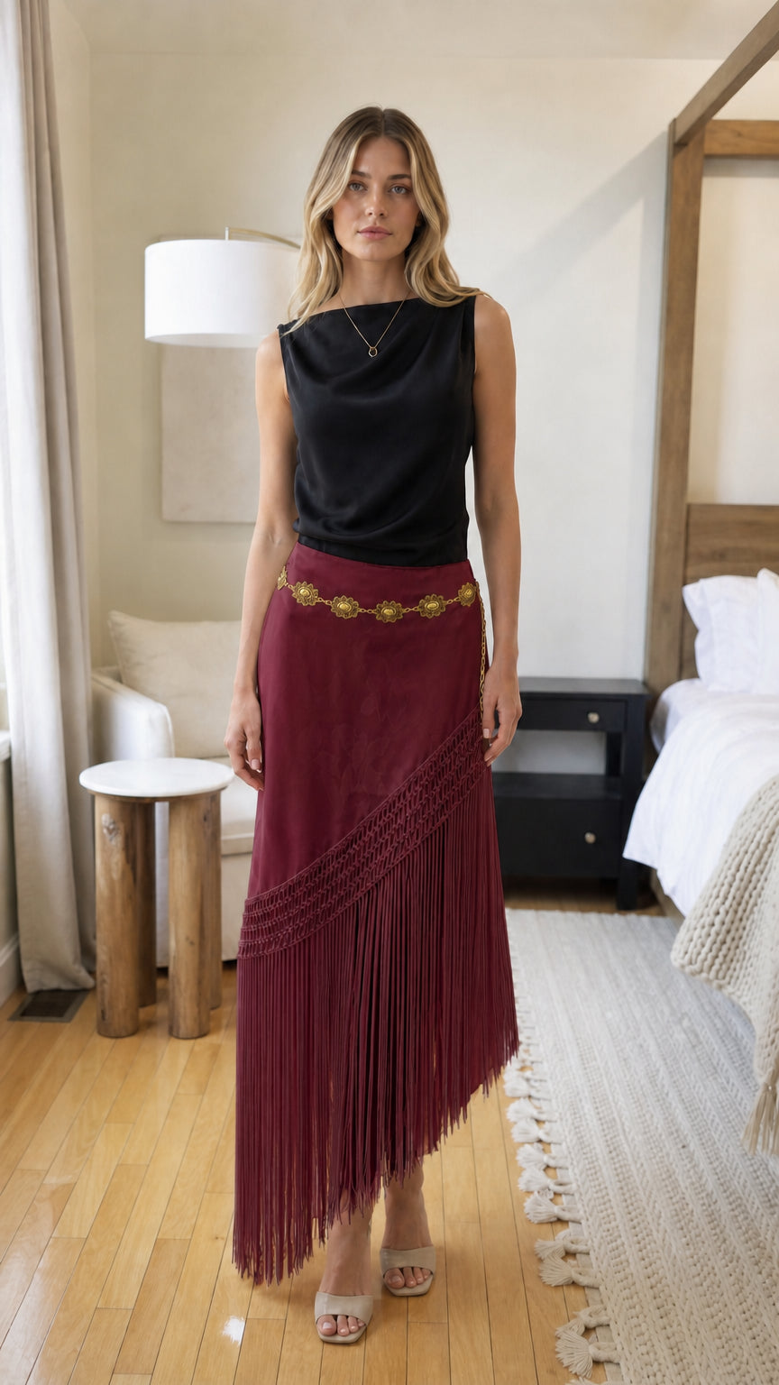 Woman wearing burgundy bohemian fringe long skirt