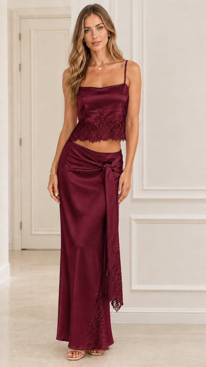 Model wearing Burgundy wine satin lace top and knot draped maxi skirt set