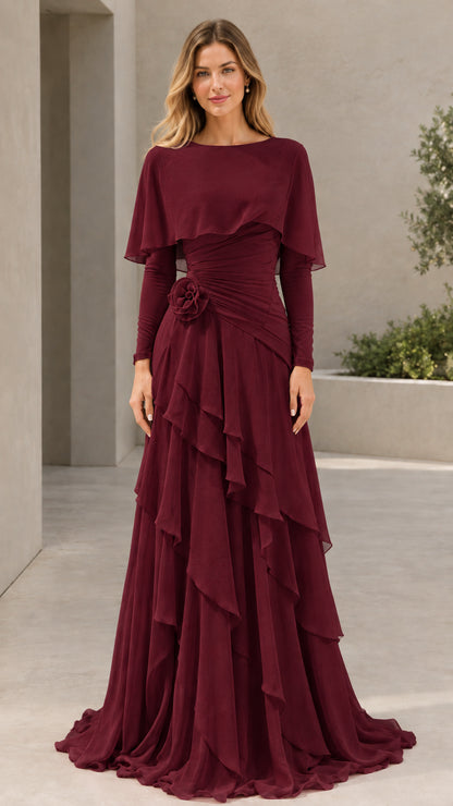 Woman wearing Burgundy long sleeve capelet tiered evening maxi gown
