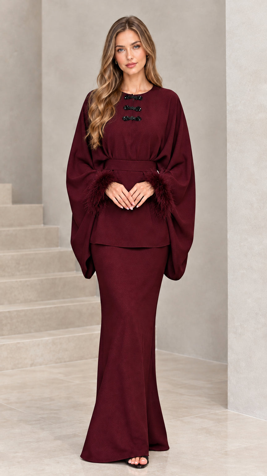 Front view of model wearing burgundy wine feather cuff evening maxi set
