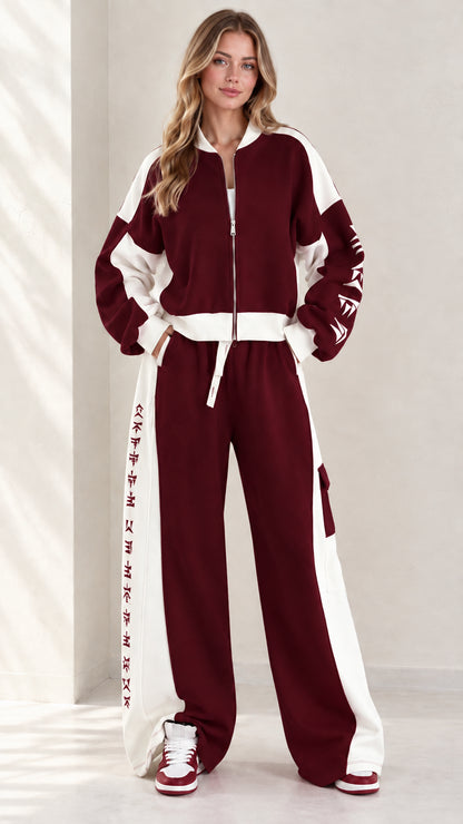 Full front view of model wearing burgundy wine and white colorblock zip-up tracksuit set