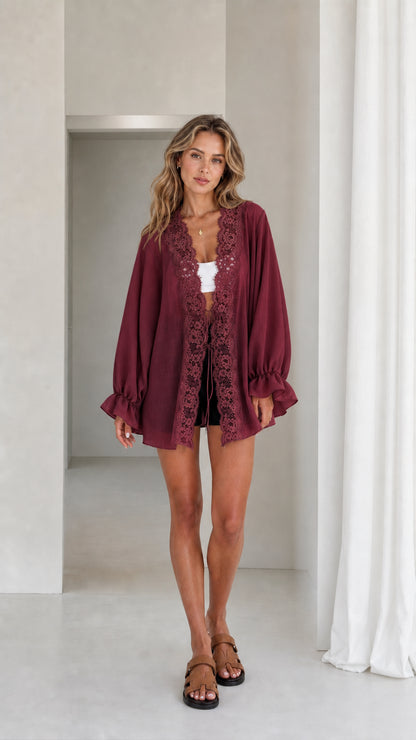 Model wearing burgundy lace trim kimono cardigan