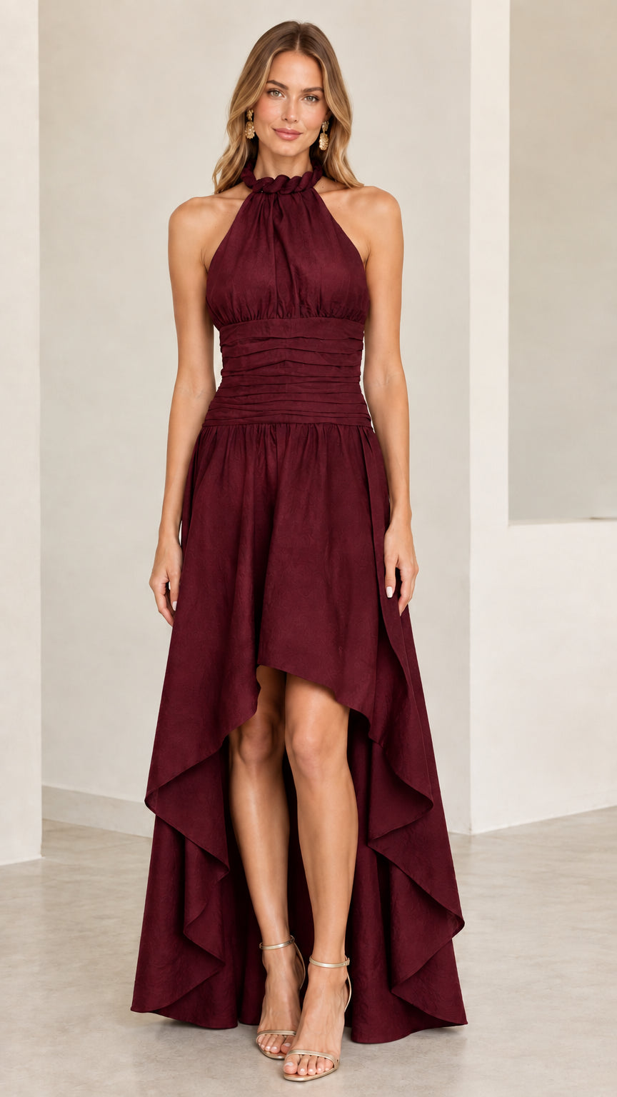 Model wearing burgundy wine halter high-low evening dress