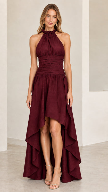 Model wearing burgundy wine halter high-low evening dress