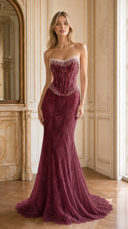 Front full-length view of burgundy strapless pearl beaded corset lace mermaid gown