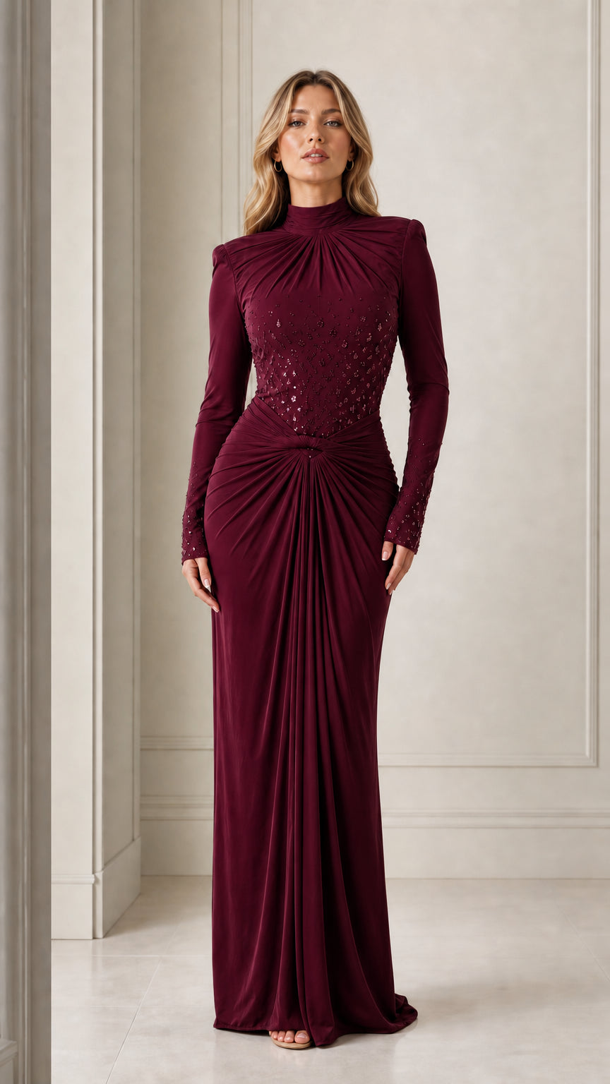 Model wearing the long-sleeve mock neck draped maxi evening gown in burgundy