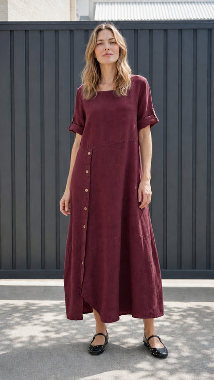 Front view of burgundy asymmetrical button-front maxi dress