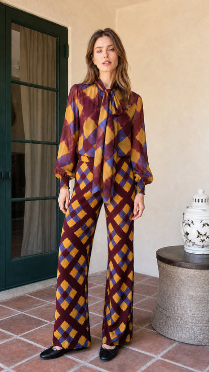 Model wearing burgundy colorway of the plaid matching set