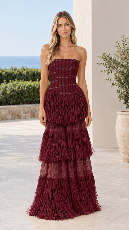Model wearing Burgundy Wine Strapless Plaid Corset Tiered Fringe Maxi Dress